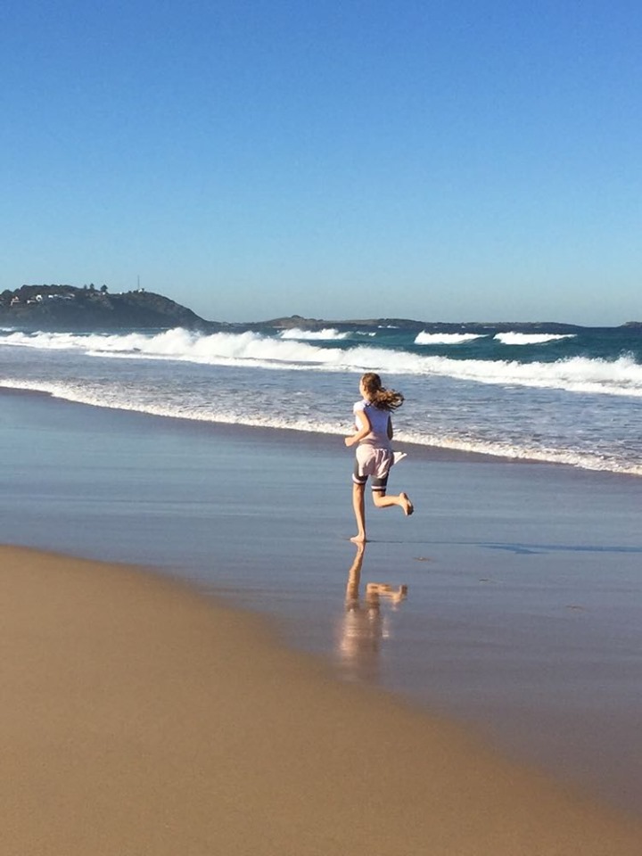 Esther running on beach